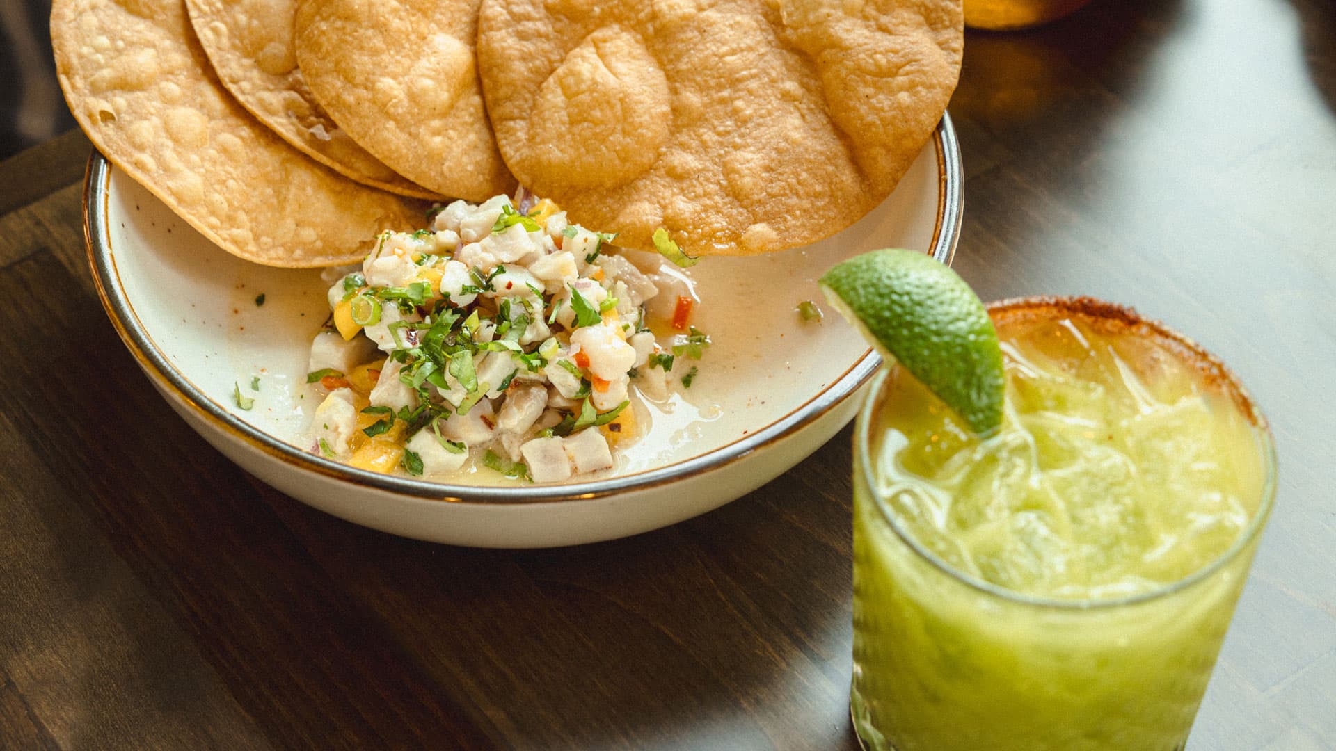 Citrus-cured ceviche of the day with avocado and serrano